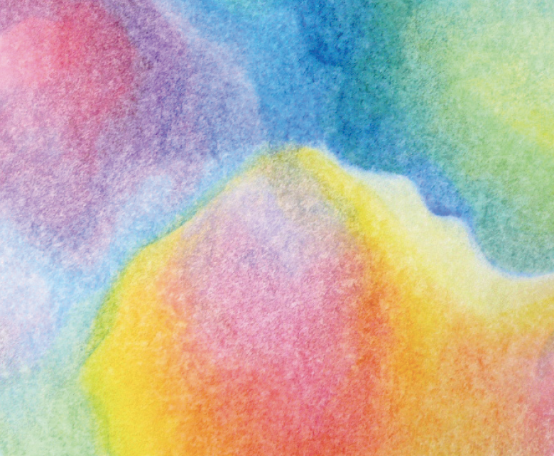 A close up detail of a mandala painting with oil colours displaying harmonious layers of rainbow colours overlapping and interacting